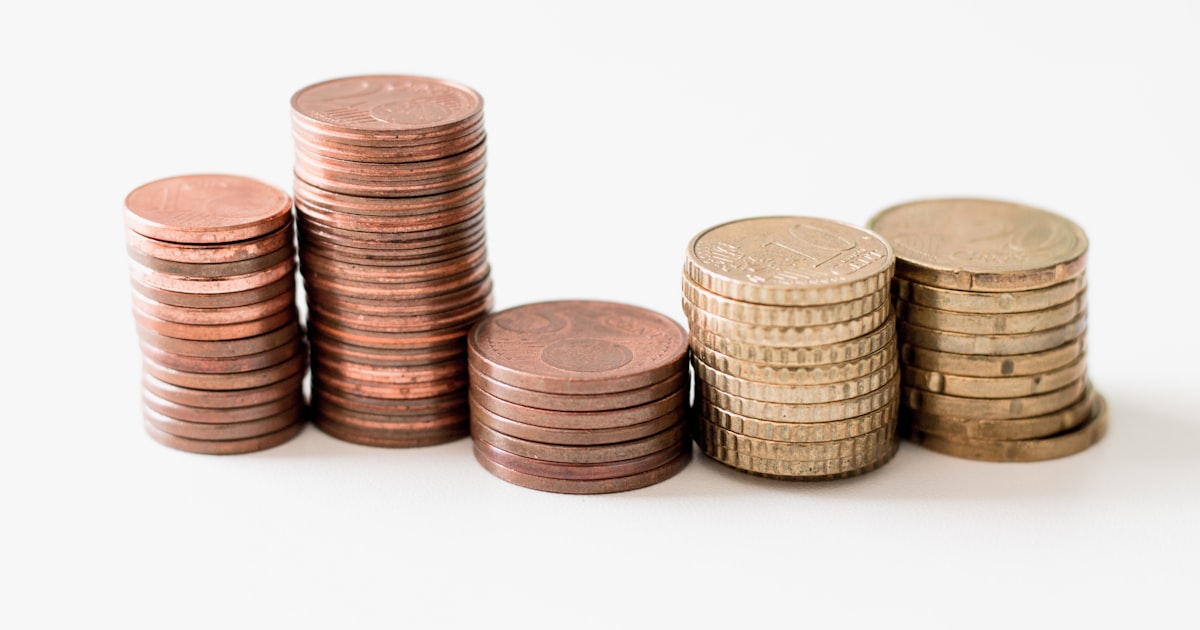Build A Diversified Portfolio With Low-Cost Index Funds Stacked Coins For Investment Growth