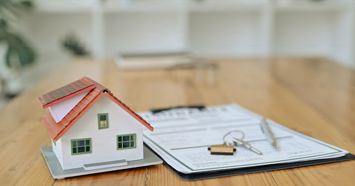 What To Negotiate When Buying A House (And What To Leave Alone) House Keys And Mortgage Contract On Desk